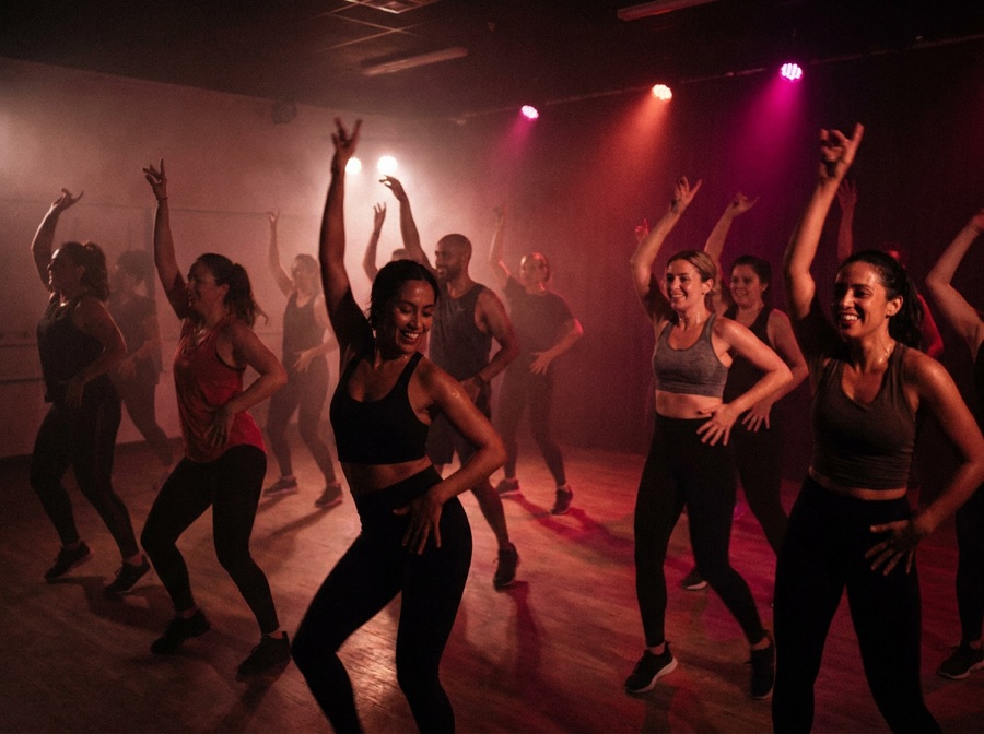 Latin dance fitness class mid-routine